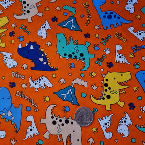 Orange Dinosaurs Quilting Cotton